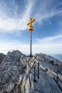 Golden summit cross on the summit of the Zugspitze, Wetterstein range, Bavaria, Germany