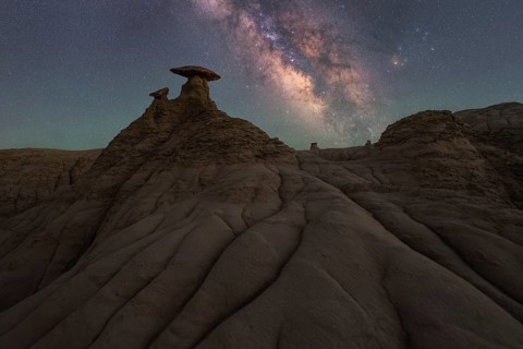 A mesmerizing view of the Milky Way shining brightly over the unique sandstone formations in Goblin