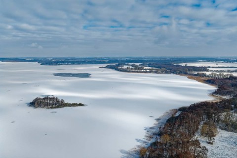 There is snow on the frozen Schaalsee near Zarrentin in the UNESCO Schaalsee Biosphere Reserve. In