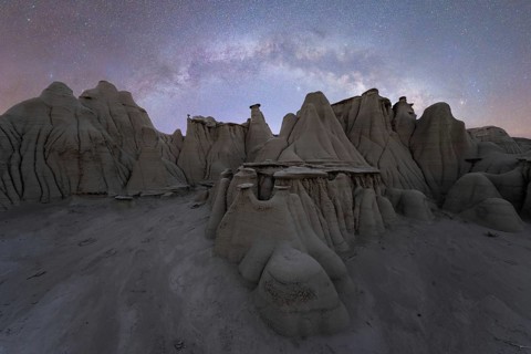 Captivating landscape of unique rock formations under a star-studded sky in Utah, USA, capturing