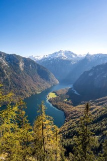 Panoramic view of the Königssee from the Archenkanzel viewpoint, autumnal forest and snow-capped