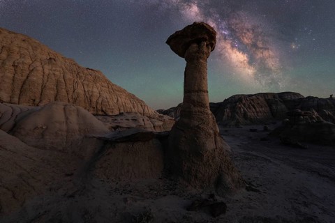 A mesmerizing night view in Goblin Valley State Park, Utah. The Milky Way glows over distinctive
