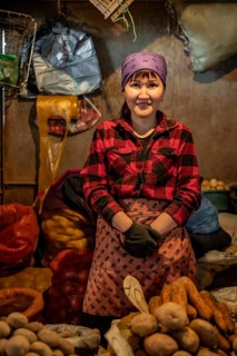 Vendor selling potatoes, stall, Osh Bazaar, Bishkek, Kyrgyzstan