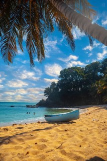 Cocalito beach in Punta de Sal and a local boat, Tela. Honduras