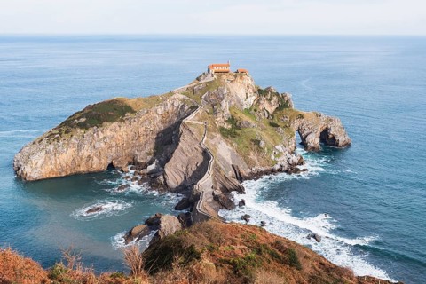 A scenic view of Gaztelugatxe, a striking islet off the coast of Bermeo in the Basque Country of