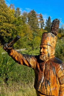 Traditional miner from the Ore Mountains, wooden sculptures of chainsaw art in the open-air museum