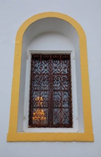 Mountain village Lakkoi with Agios Antonios church, church window, Crete, Greece