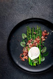 Asparagus with poached egg and fried bacon, micro greens and spices, breakfast, homemade, no people