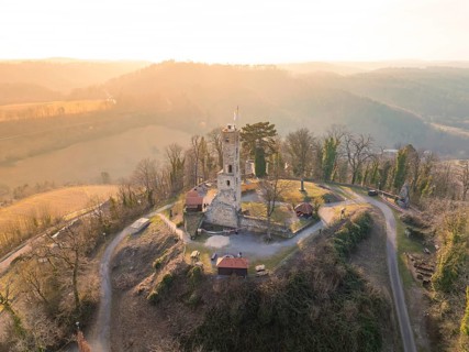 Ruin on a hill with roads and bare trees in a misty landscape at sunset, Löwenstein Castle,