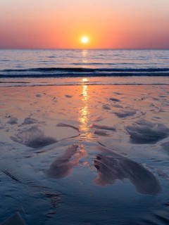 Sunset by the sea at Gwithian Beach. Gwithian, Hayle, Cornwall, England, Great Britain