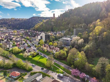 Town embedded in forest landscape with hills and blue sky, Bad Liebenzell, district of Calw, Black