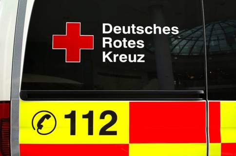 Logo DRK German Red Cross, emergency number 112, on RTW, ambulance, Stuttgart, Baden-Württemberg,