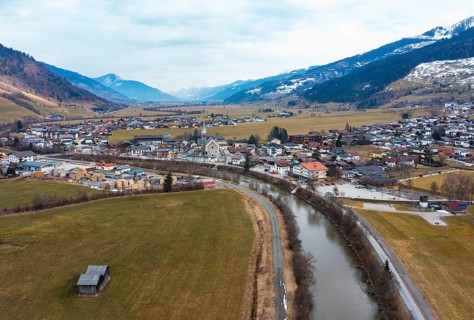 Drone image, residential buildings, view of village with parish church, Niedernsill, Salzach,