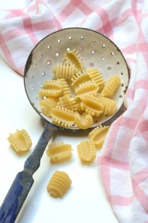 Italian pasta in a sieve, Radiatori variety