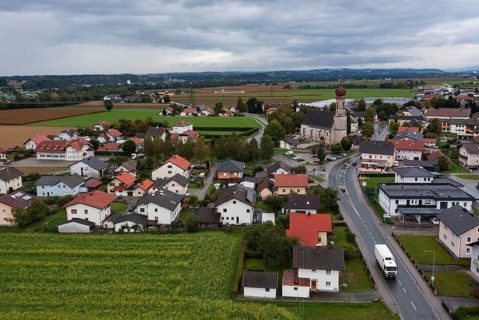 Drone shot, view of village with church, Burgkirchen, Innviertel, Upper Austria, Austria