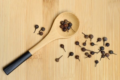 Cubeb pepper, peppercorns in wooden spoon, Piper cubeba