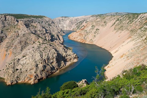 A deep river meanders through rocky cliffs under a clear sky, Pariževacka Glavica, Parizevacka,