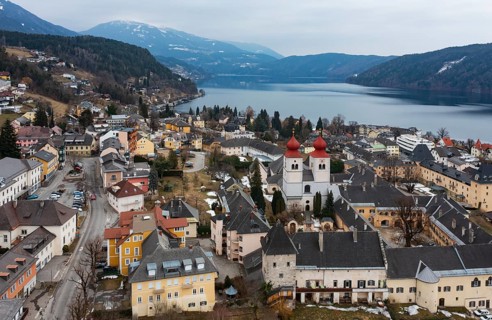 Drone shot, view of the town, Millstatt Abbey, Millstatt, Lake Millstatt, Carinthia, Austria