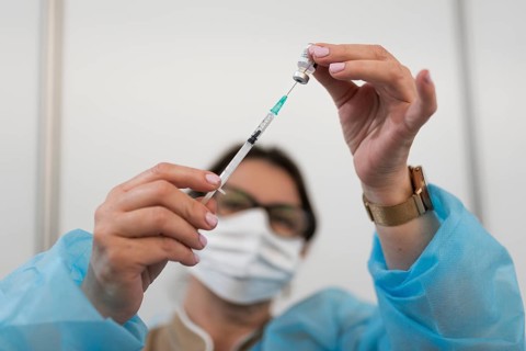 Hands of a doctor with syringe in Lubin, Poland
