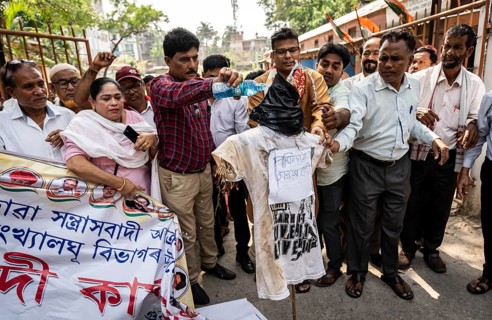 Members of the Congress Party prepare an effigy named 'Pakistani Terrorist' as they protest over