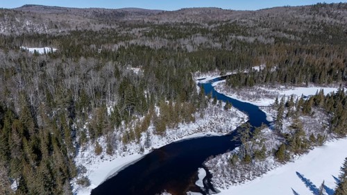 Wolf river. unfrozen part of the river in winter. Mastigouche wildlife reserve.. Province of Quebec