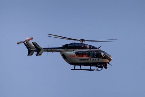 A police helicopter circles in the air over Frankfurt am Main, Frankfurt am Main, Hesse, Germany