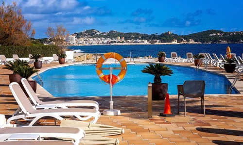 Swimming pool and sun loungers, Cala Rajada, Majorca, Spain