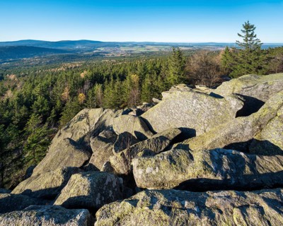 View from the Kösseine over the forests of the Fichtelgebirge, sea of boulders on the summit,