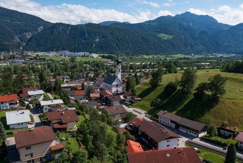 Drone image, view of village with parish church, Breitenbach am Inn, Inntal, Tyrol, Austria