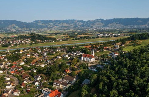 Drone image, view of town with parish church, Koblach, Rhine Valley, Vorarlberg, Austria