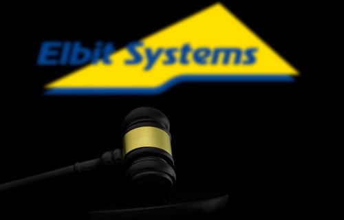 Court gavel in front of the Elbit systems logo. Elbit Systems Ltd is an Israel based international