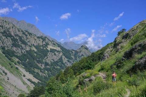 Woman standing on hiking trail to Lago del Vei del Bouc, Entracque, Province of Cuneo, Italy