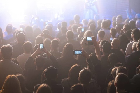 Crowd of people in front of the stage during the concert