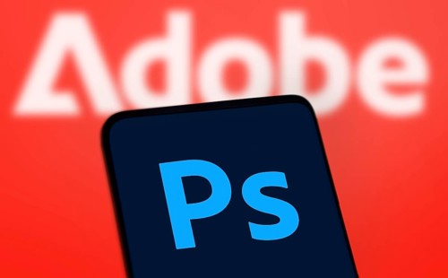 Adobe photoshop logo is displayed on smartphone. Adobe Photoshop is a raster graphics editor