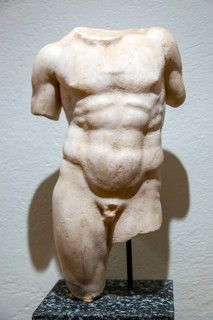 Roman carved stone torso of young man, archaeology museum, Apollonia Archaeological Park, Albania