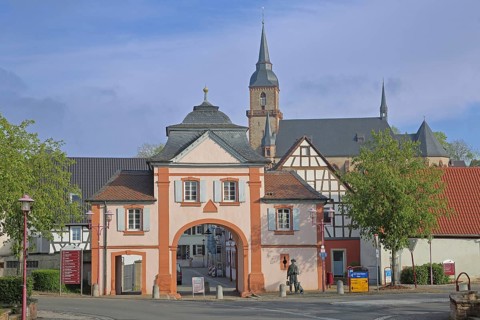 Historic Kerzenheim gate built in 1776 with neo-Gothic St John Nepomuk church, town gate,