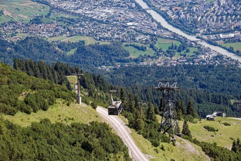 Cable car of the Innsbruck Nordkettenbahnen at the Seegrube, view of Innsbruck and the mountains of