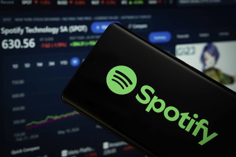 Dhaka, Bangladesh- 18 March 2025: Spotify logo is displayed on a smartphone screen, with a stock