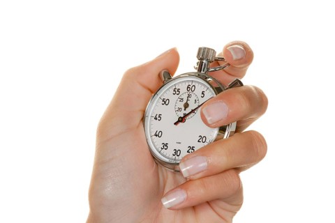 A hand with an old mechanical stopwatch, timepiece studio photo, Austria