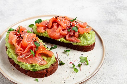 Breakfast, Sandwiches with smoked salmon and avocado, on dark rye bread, with microgreens, on a