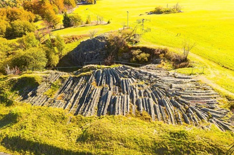 Aerial view of the fan-shaped basalt outcrop of the former quarry on the Hirtstein, called