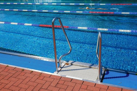 Hagen, North Rhine-Westphalia, Germany - Ladder at the edge of the swimming pool in the Hengstey