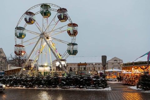 Ferris wheel at the snowy Christmas market on the market square of the Hanseatic city of Wismar, in