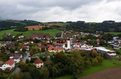 Drone shot, view of village with church, Enzenkirchen, Innviertel, Upper Austria, Austria