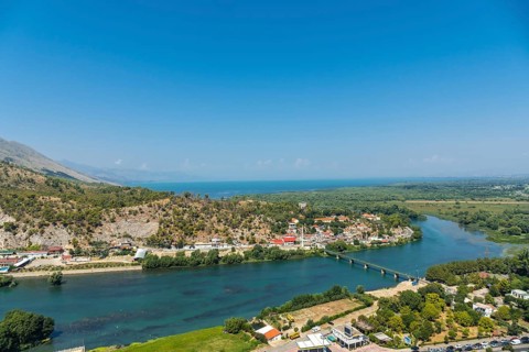 The walls of Rozafa Castle and its citadel in the city Shkoder along the lake river. Albania