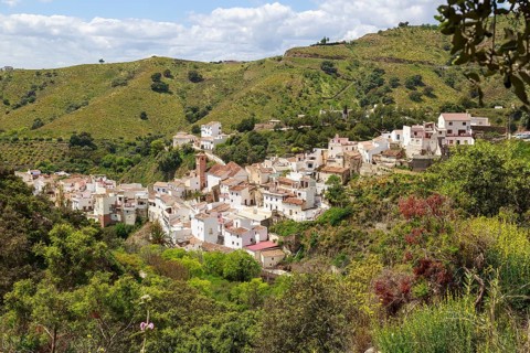 The white village of Salares at the foot of the Sierra Tejeda, picturesquely situated on a hill,