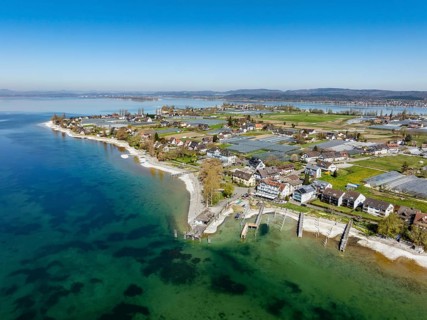 Aerial view of the southern part of the island of Reichenau at low tide and spring-like vegetation,