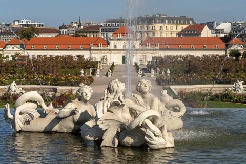 Fountain in the palace gardens and the Lower Belvedere in Vienna, Austria