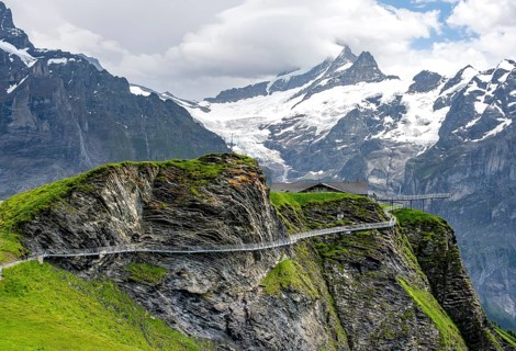 Tourist attraction First Cliff Walk, metal trail on a rocky outcrop, Grindelwald First, in front of