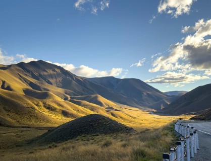 Serene beauty of autumn on Mount Cook, New Zealand, where golden hues blanket the landscape. The